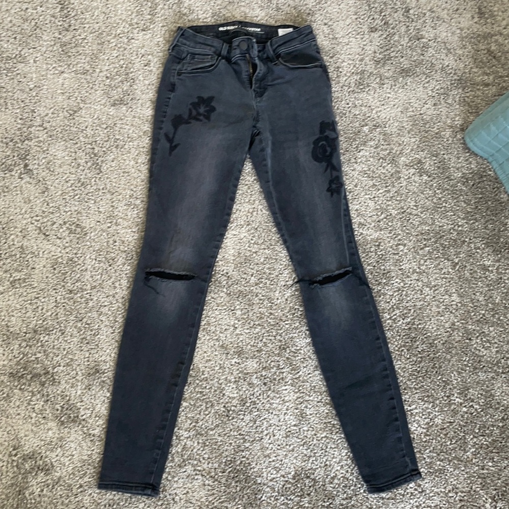 Old Navy black jeans with rips in knees and flower detail